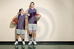 Tall and short basketball players photo