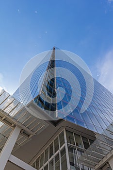 Tall skyscraper against blue sky