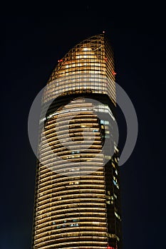 tall skyscrapers in the night light. View of modern city of abu dhabi. United Arab Emirates