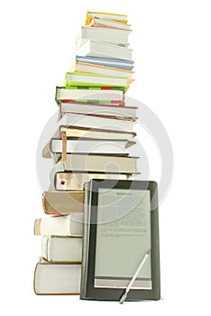 Tall stack of books and e-book reader