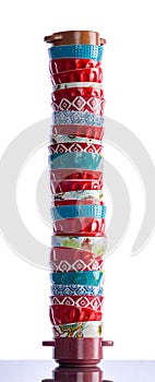 Tall stack of colorful clean baking ramekins photo