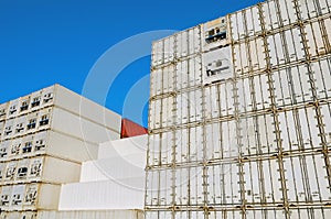 Tall stacks of shipping containers awaiting transport