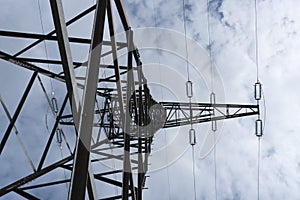 tall steel high voltage pylon mast clouds