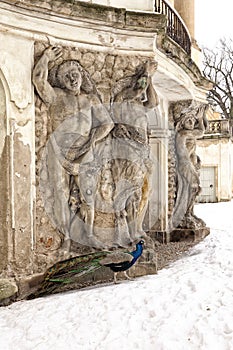 Tall stone figures holding castle balcony