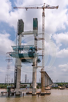 Tall suspension pylon at Phuoc Khanh bridge under construction, Vietnam