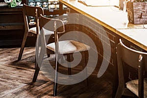 Tall table - Wooden table steel legs simplistic, tall bar stools in stylish kitchen with wooden cupboards.