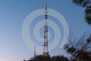 Tall telecommunication tower at night