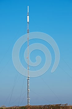 Tall telecoms mast in the English countryside