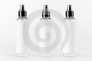 Tall transparent spray dispenser bottles for cosmetics product collection in a row with white label on white background, mock up.