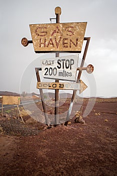 Tall vintage gas sign standing in the desert