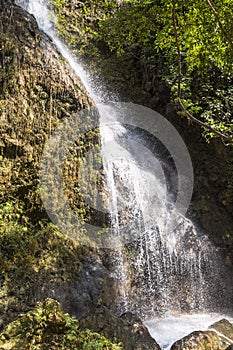 Tall waterfall floating inside water pool, Indonesia