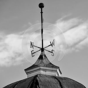 Tall Weather Vane on Top of Cupola