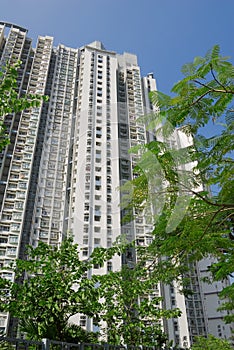 Tall white apartment exterior in the street