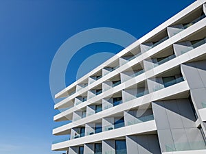 Tall White Building With Lots of Windows