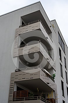 tall white building with lots of windows and balconies