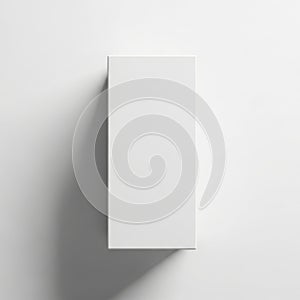 A tall white rectangular object casting a distinct shadow on a plain background