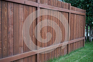 Tall wood fence dark brown