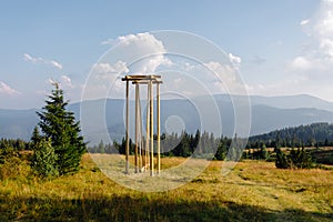 Tall wooden structure in field