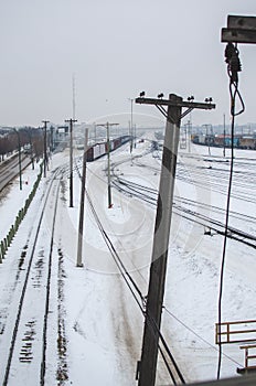 Tall wooden telephone poles along the train tracks in Winnipeg, Manitoba, Canada