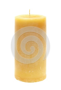 Tall yellow wax candle on white