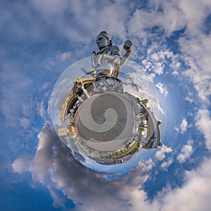 tallest hindu shiva statue in india on mountain near ocean on little planet in blue sky with evening clouds, transformation of