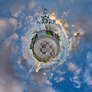 tallest hindu shiva statue in india on mountain near ocean on little planet in blue sky with evening clouds, transformation of