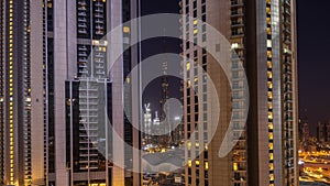 Tallest skyscrapers in downtown dubai located on bouleward street near shopping mall aerial all night timelapse.