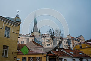 Tallinn, Estonia: Church of St. Olaf. Church spire in foggy and gloomy weather in the old town