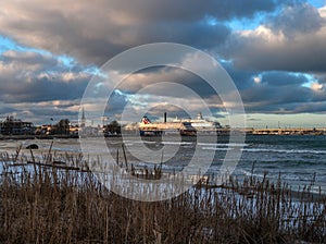 Tallinn, Estonia - January 4, 2020: View of the port of Tallinn from the boardwalk along Pirita Street. Ferries docked