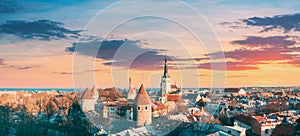 Tallinn, Estonia. Panoramic View Of Part Of Tallinn City Wall With Towers, At Top Of Photo There Is Tower Of Church Of