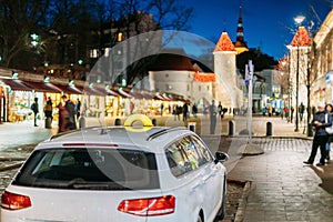 Tallinn, Estonia. Taxi Car Parking Near Viru Gates Entrance To Old Part Town Estonian Capital. Famous Landmark Viru Gate