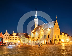 Tallinn, Estonia. Town Hall Square - Raekoja Plats. Famous Landmark In Evening Night Illumination Under Blue Sky.