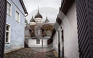 Tallinn old city street in dull, murky rainy evening