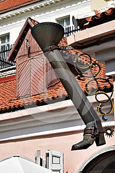 Tallinn old medieval town long leg street symbol, a gutter in the shape of a long boot.