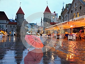 Tallinn  Old Town Panorama  city light  pink umbrella  rainy season street evening lightening  blurring bokeh city  people walking