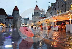 Tallinn  Old Town Panorama  city light  pink umbrella  rainy season street evening lightening  blurring bokeh city  people walking