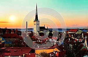 Tallinn old town  sunset  panorama on  medieval red roofs towers at evening sun light  travel to Estonia