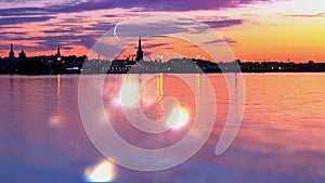 Tallinn panorama City Old Town seascape Sunset Night sky moon and stars in Harbor  horizon blue lilac water light reflection twil photo