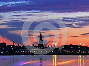 Tallinn  panorama old town   Estonia capital city baltic sea bokeh evening light effekt blurring reflection on water pink yellow b