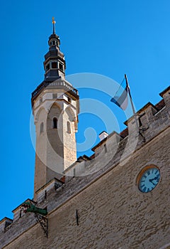 Tallinn Town Hall, Estonia. Fragment. Tower and flag of Estonia. Tallinn city Hall is an architectural monument of the