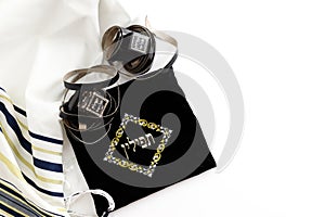 Tallit, tefillin and Kipah on white background, ritual Jewish objects