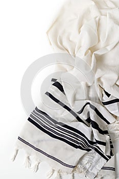 Tallit on white background. Jewish ritual objects, prayer vestments