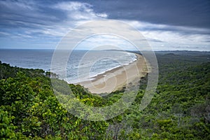 Tallow Beach and Arakwal National Park view from Cape Byron Lighthouse During Dramatic Weather, Byron Bay, NSW Australia.