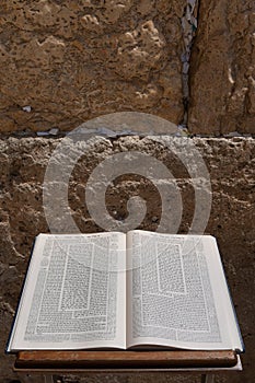 An open Talmud on a stand in front of the Western Wall in Jerusalem. photo