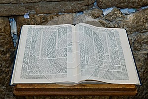 An open Talmud on a stand in front of the Western Wall in Jerusalem. photo