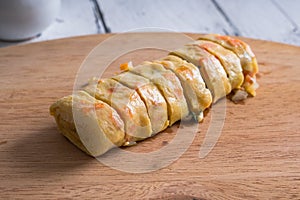 Tamagoyaki or Japanese egg rolls with carrots, spring onion and dashi