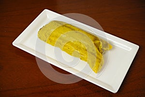 Tamal Typical Colombian Food Wrapped in Banana Leaves