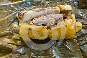 Tamale Colombian food recipe with banana leaves steamed
