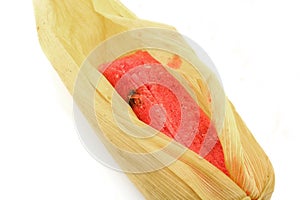 The tamale is a food of Latin American origin generally prepared from corn or rice dough stuffed with meats, vegetables, chili photo
