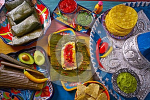 Tamale Mexican food recipe with banana leaves photo